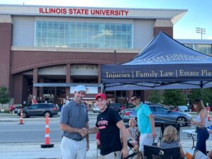 Injury lawyer Dustin Kothof Koth Gregory & Nieminski with a client at ISU Football game in Bloomington-Normal IL